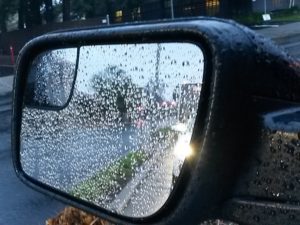 Rain drops on car mirror
