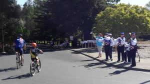 ladies cheering on the bicyclists